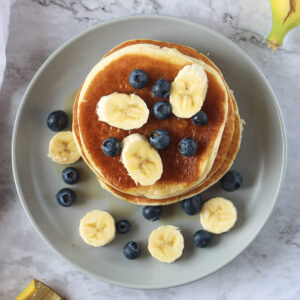 oat milk pancakes with blueberries and bananas